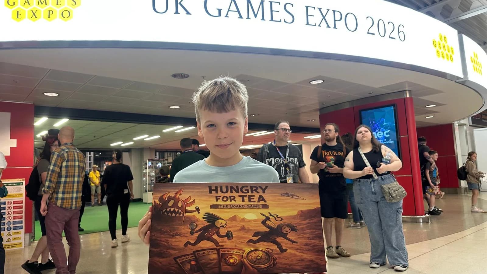 Benjamin holding Hungry for Tea at UK Games Expo